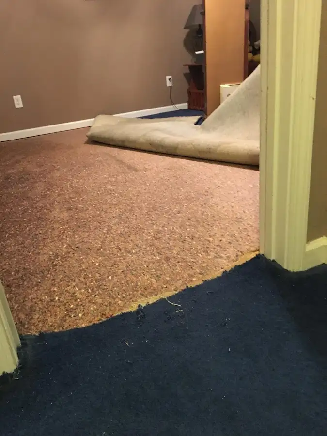 Carpet pad removal revealing water damage during Drying & Dehumidification in Idabel